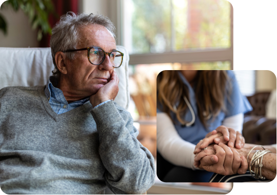 Older adult sitting with a caregiver providing comfort at home.