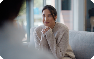 Hospice nurse meeting with a patient or family member at home.