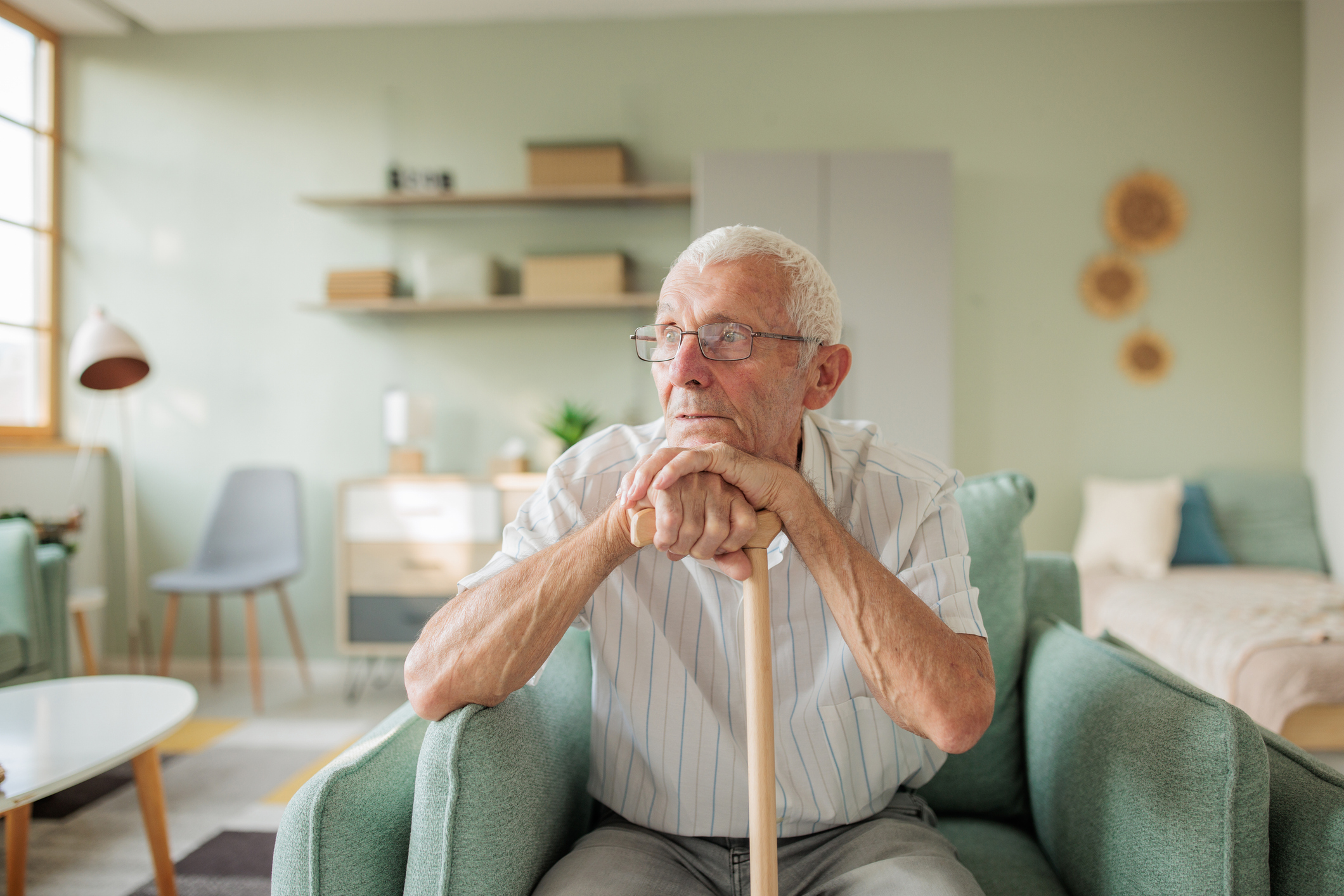 Hospice professional supporting an older adult while discussing care planning at home
