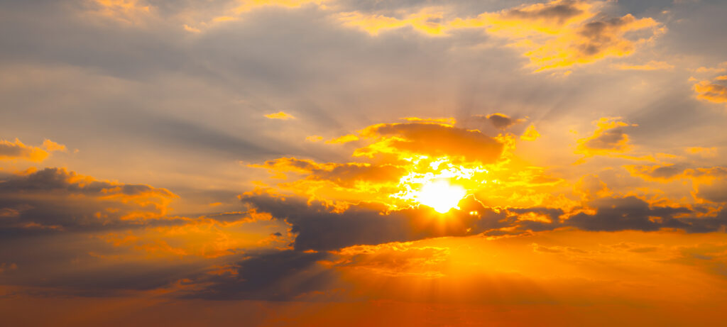 Sunlight breaking through clouds to represent peace, comfort, and reassurance in advance care planning