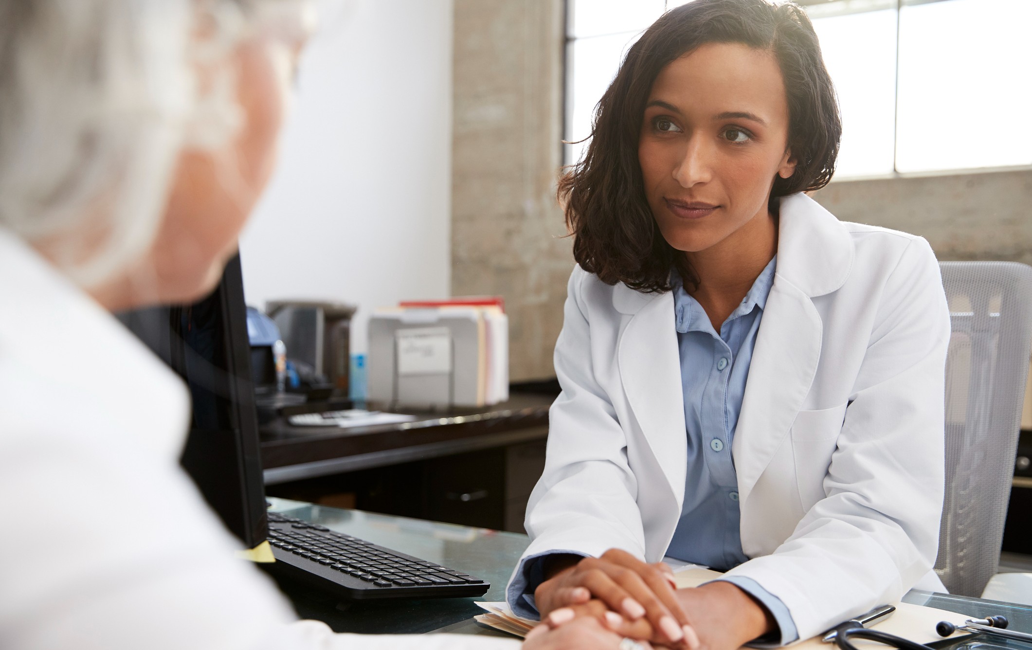 Caregiver meeting with an older adult during an advance care planning discussion